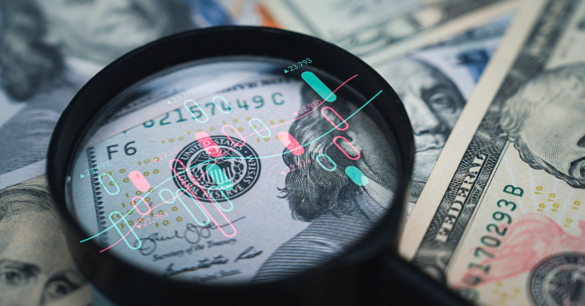 hundred dollar bill with magnifying glass and stock pattern - etfs vs mutual funds
