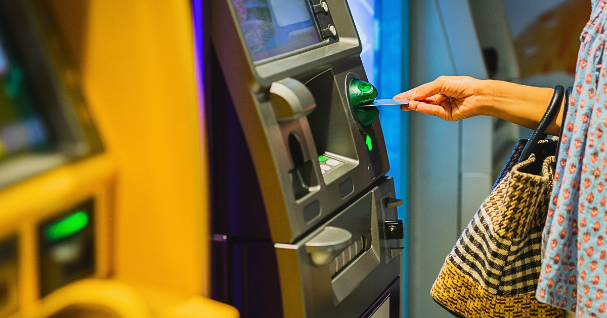 Person accessing their bank account at an ATM