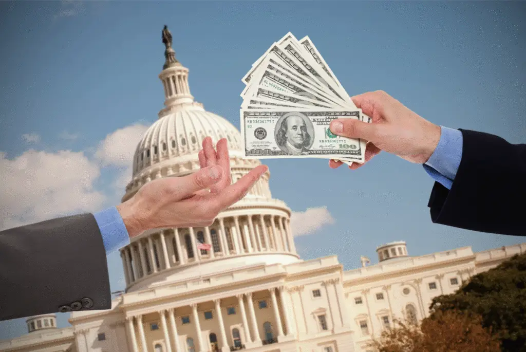 image of business men handing cash in front of the white house -- what is lobbying in politics?