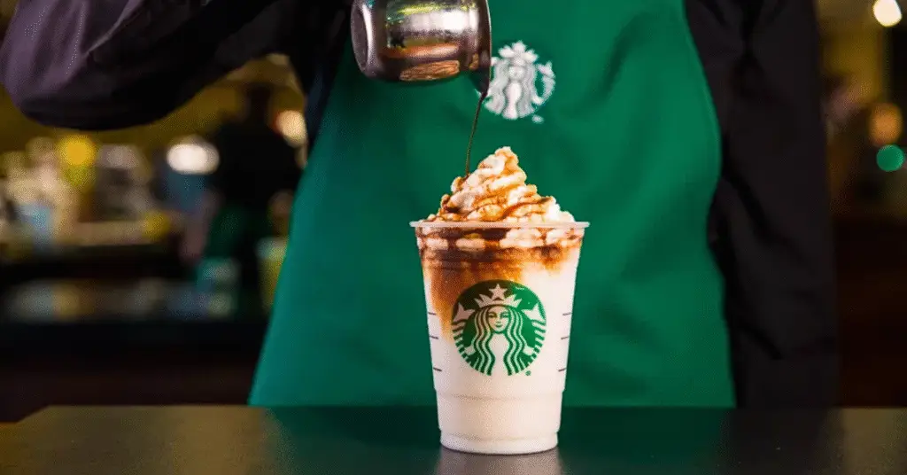 Starbucks employees serving a coffee - details of the Starbucks closures